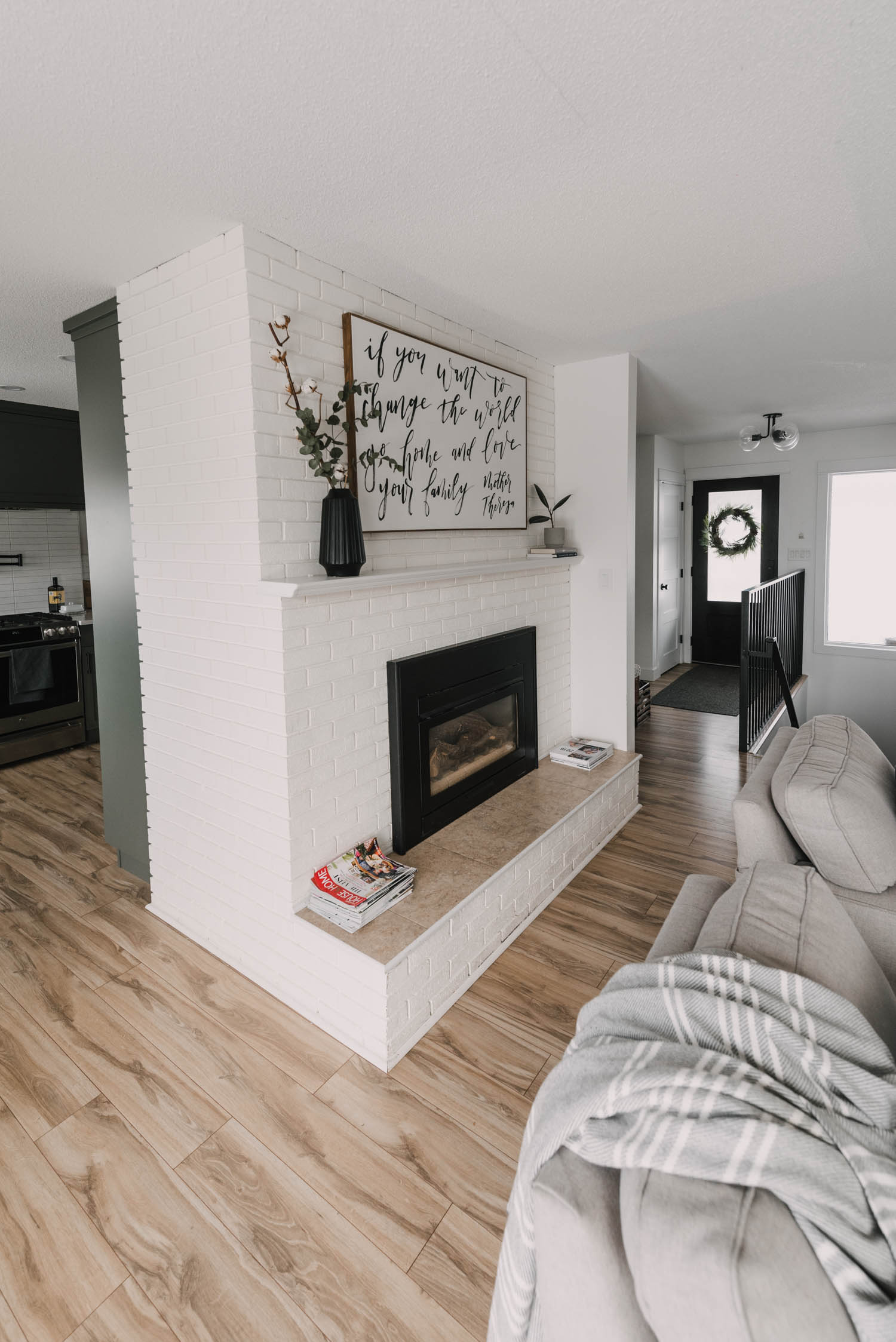 Large fireplace in the centre of all spaces for this Semi Open Concept floor plan for a rancher