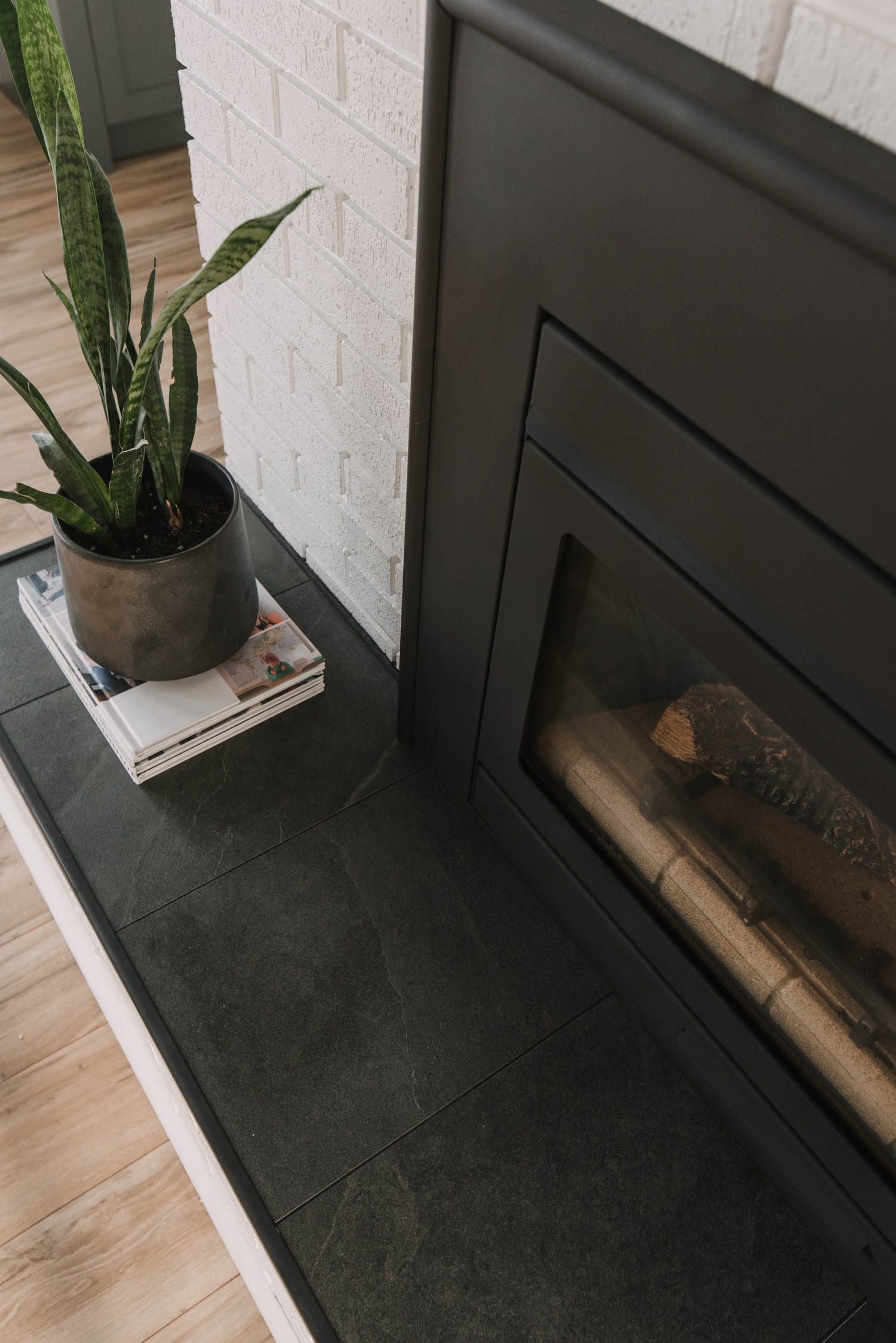 Black tile hearth to mimic slate