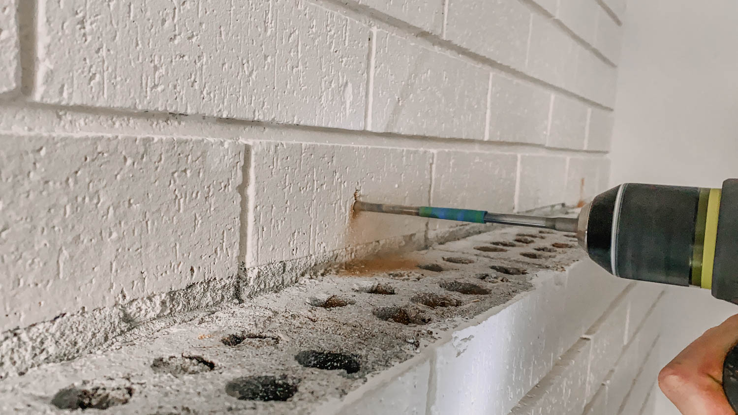 How to install a chunky wood mantel on brick