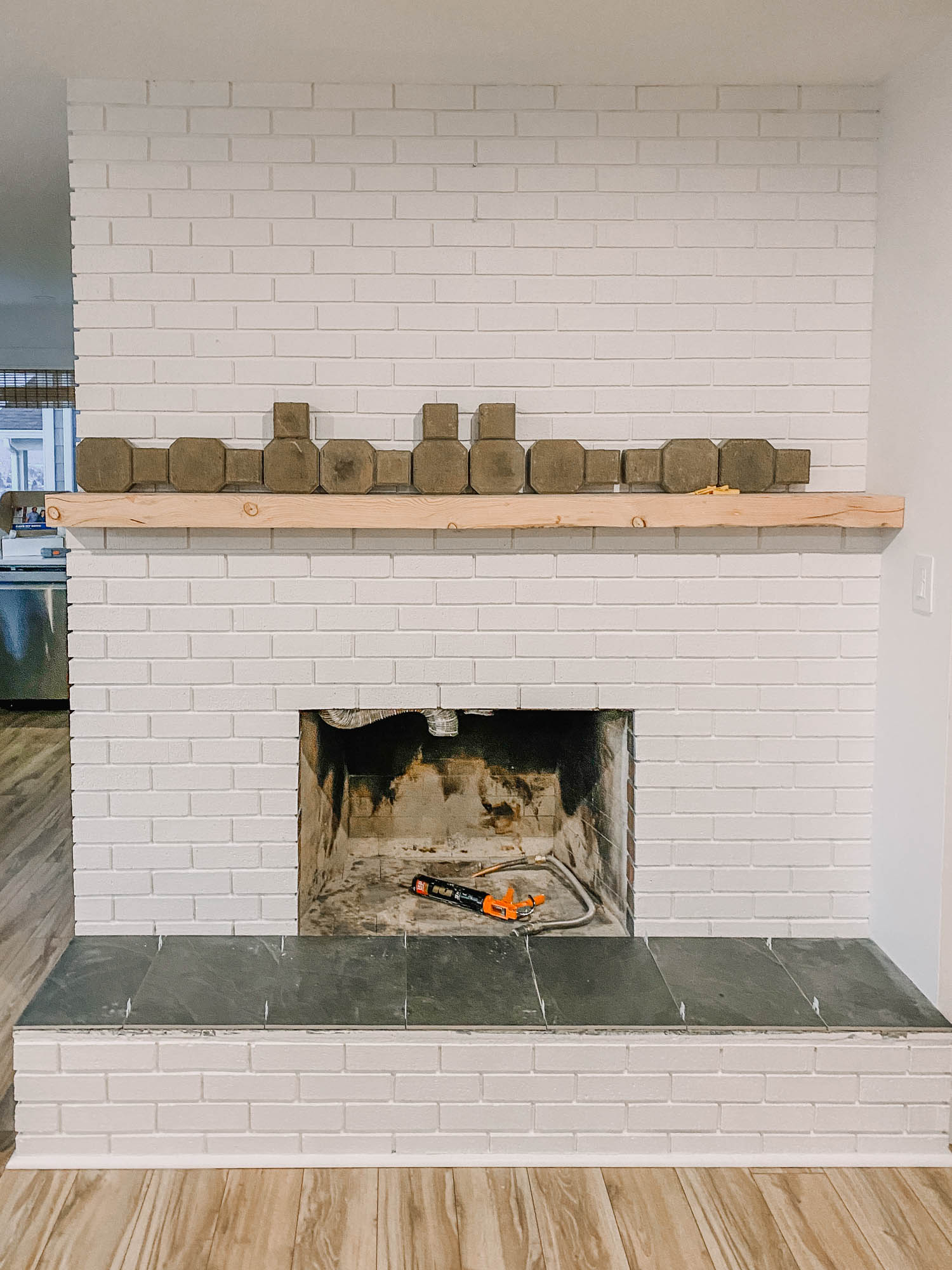 How to install a chunky wood mantel on brick
