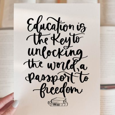 Education is the key to unlocking the world, a passport to freedom. Free printable quote held over books