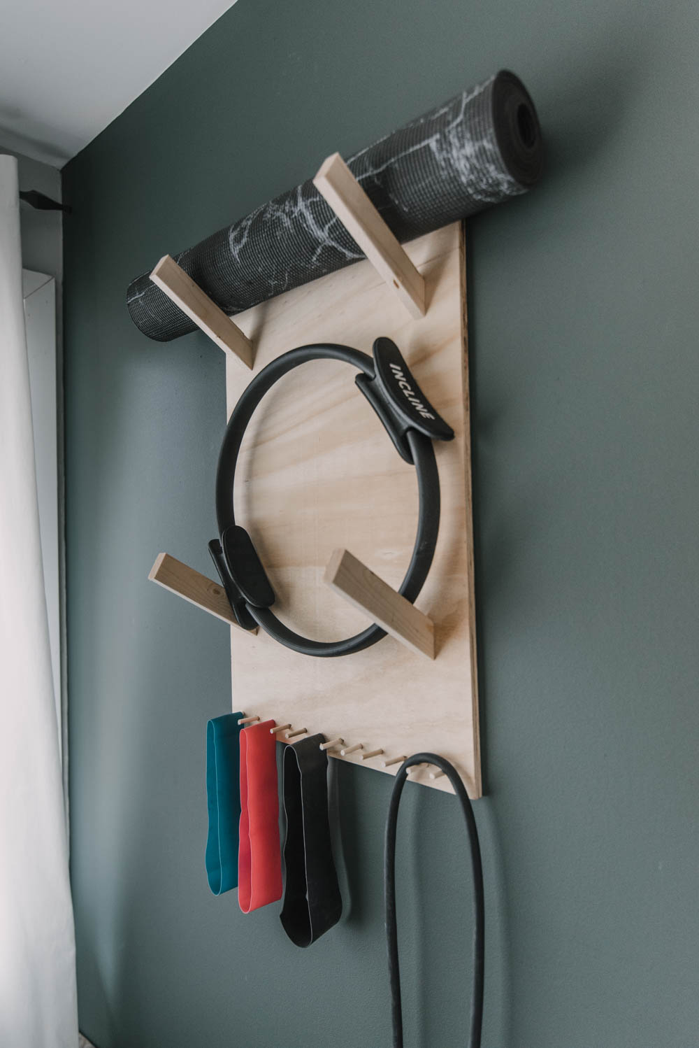 Wall Mounted storage for yoga mats and bands