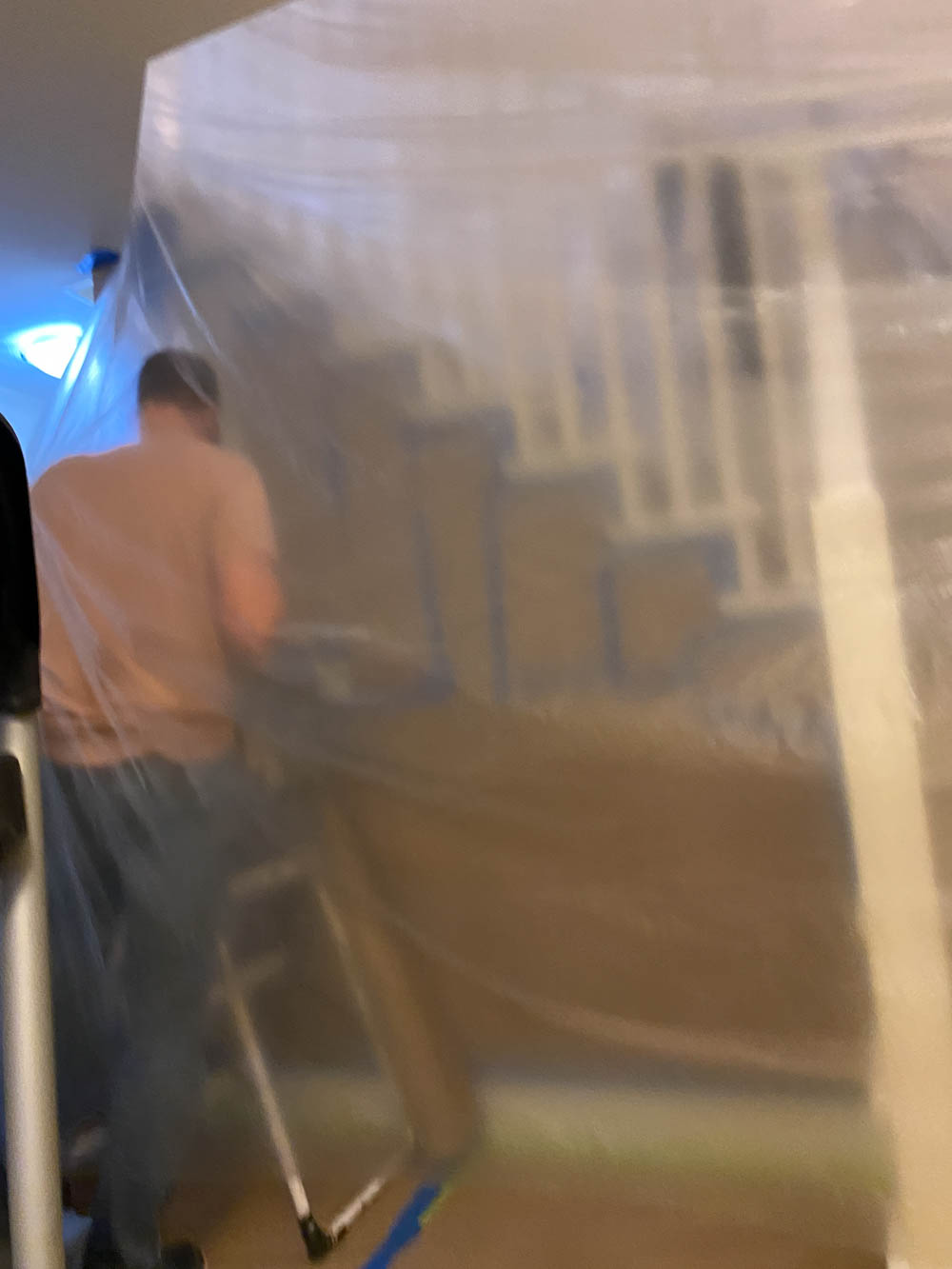 Walling off a space for using a paint sprayer